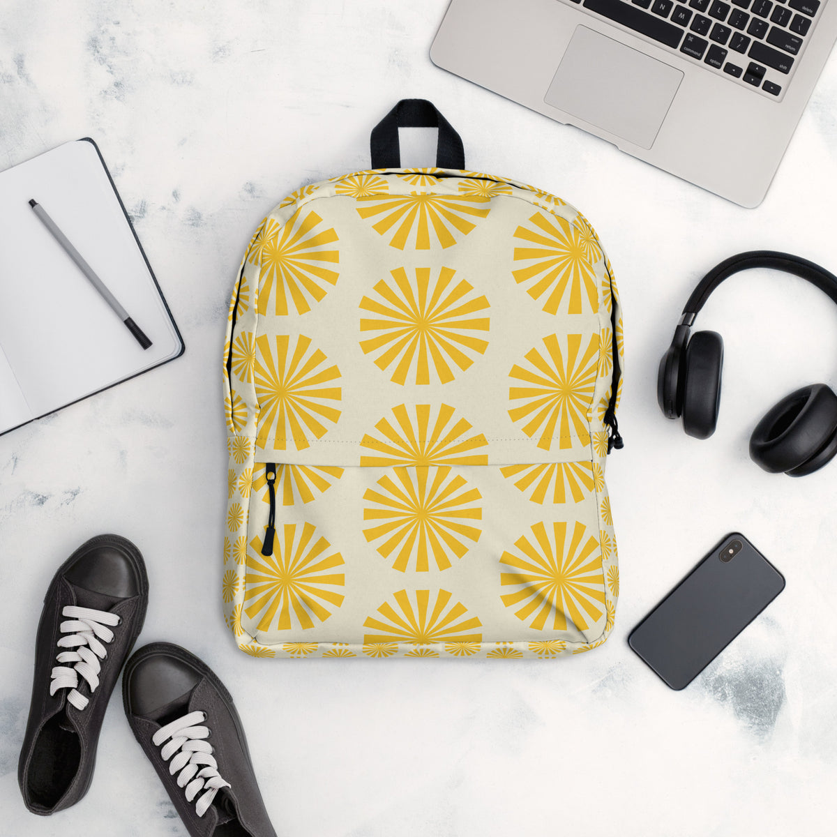 Sunburst yellow backpack with retro geometric pattern on white background