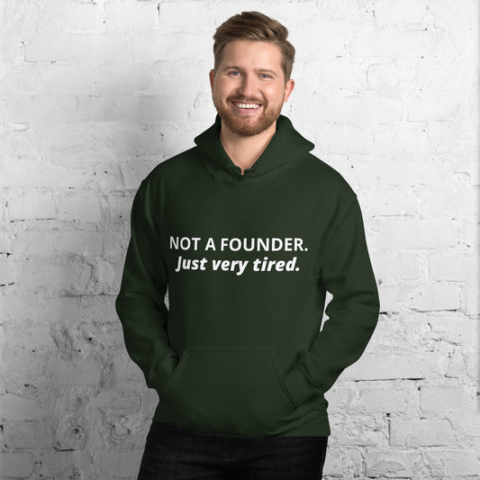 Forest green hoodie with white text 'NOT A FOUNDER.' and italic 'Just very tired.' worn by model