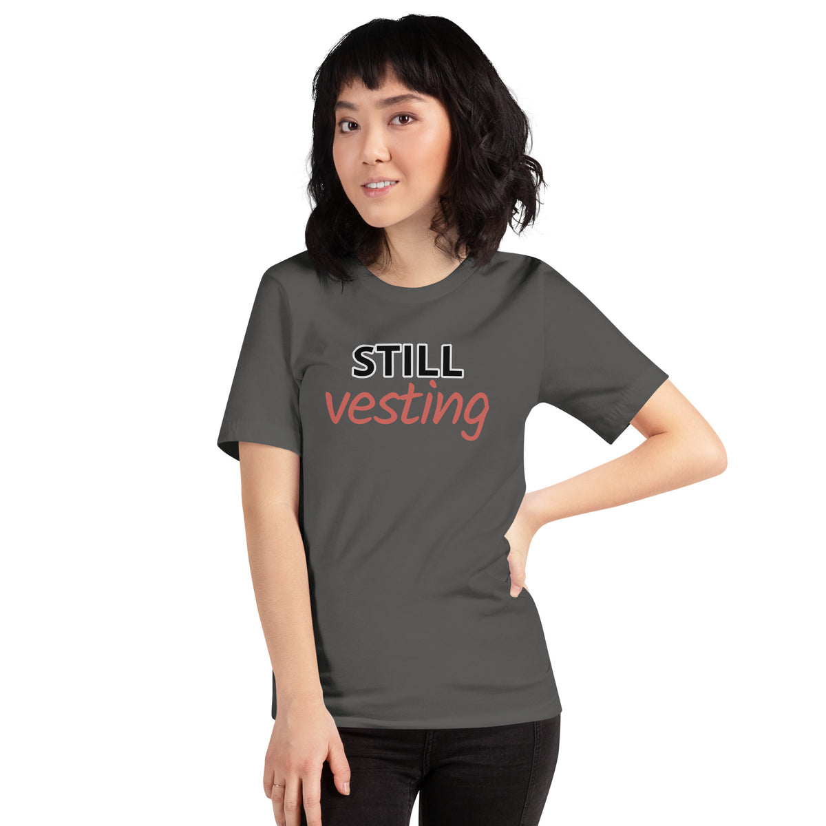 Charcoal t-shirt with bold white 'STILL' and rust-orange script 'vesting'