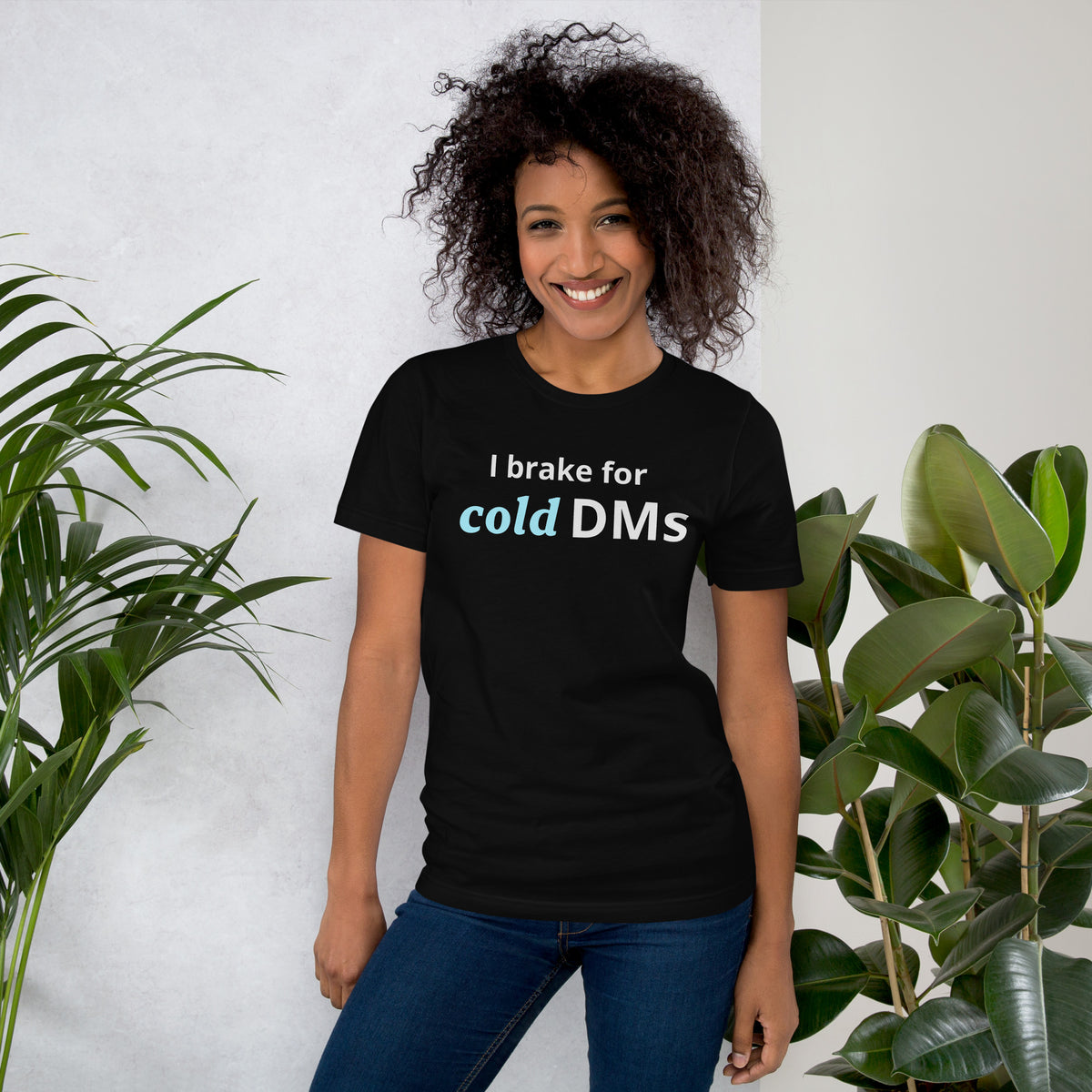 Black t-shirt with white text 'I brake for' and italic ice-blue 'cold' followed by white bold 'DMs'