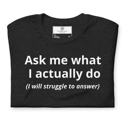 Black t-shirt with bold white text 'Ask me what I actually do' and italic '(I will struggle to answer)' below