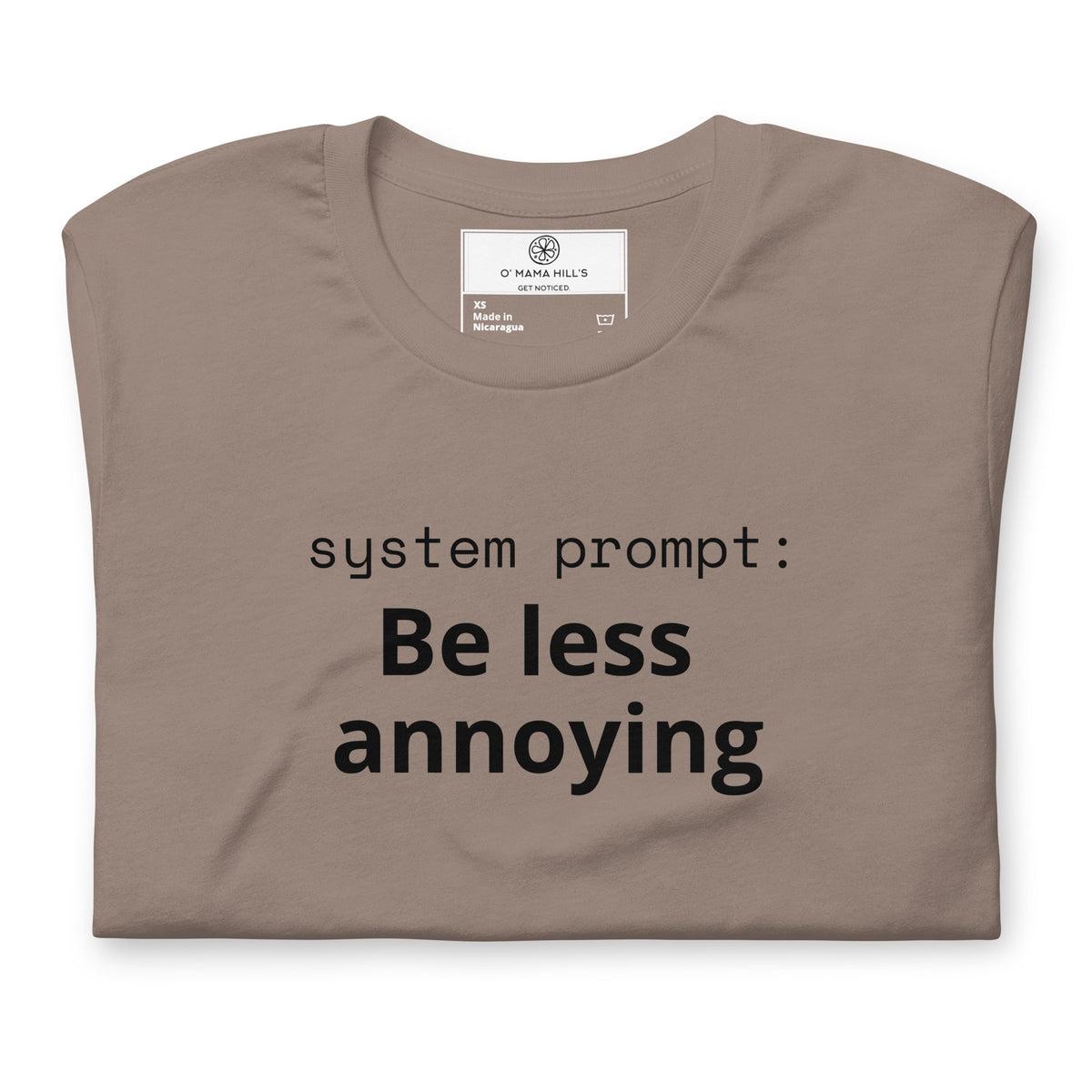 Pebble t-shirt with lowercase mono text 'system prompt:' and bold black text 'Be less annoying' below