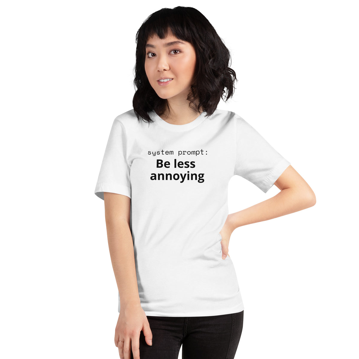 White t-shirt with lowercase mono text 'system prompt:' and bold black text 'Be less annoying' below